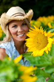 Pretty blond woman with Sunflowers