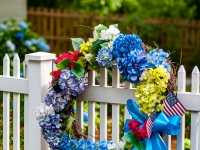 Summer wreath on a picket fence