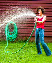 Spraying  water on the photographer.