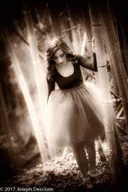 19 year old brunette woman in dance clothing on a path in a bamboo forest
