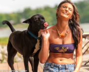 Young woman playing with her dog.