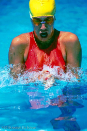 Teenage girl swimming the breast stroke