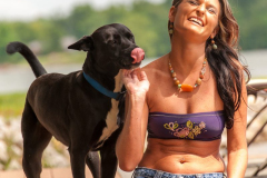Young woman playing with her dog.
