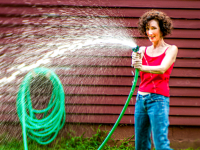 Spraying  water on the photographer.