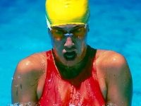 Teenage girl swimming the breast stroke