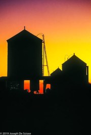 Silhouette of water tanks at sunset, New York City
