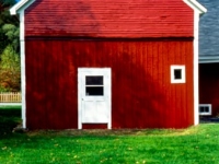 Red barn with green grass, blue sky, Vermont