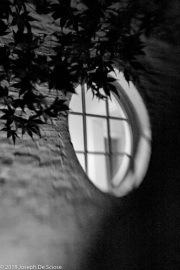 Oval window in the wall of a house