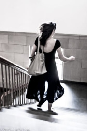 Silhoute of a woman running down stairs