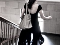 Silhoute of a woman running down stairs
